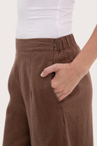 Close-up texture of the breathable linen fabric and garment construction