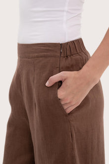 Close-up texture of the breathable linen fabric and garment construction