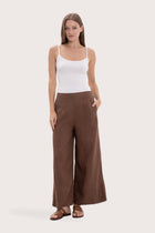Model wearing the choco linen maxi length wide pants by By The Sea Bali