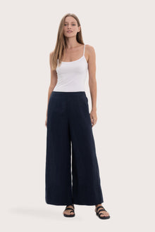 Model wearing the navy linen maxi length wide pants by By The Sea Bali