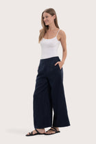 Side profile of the navy linen maxi length pants showcasing the wide-leg cut