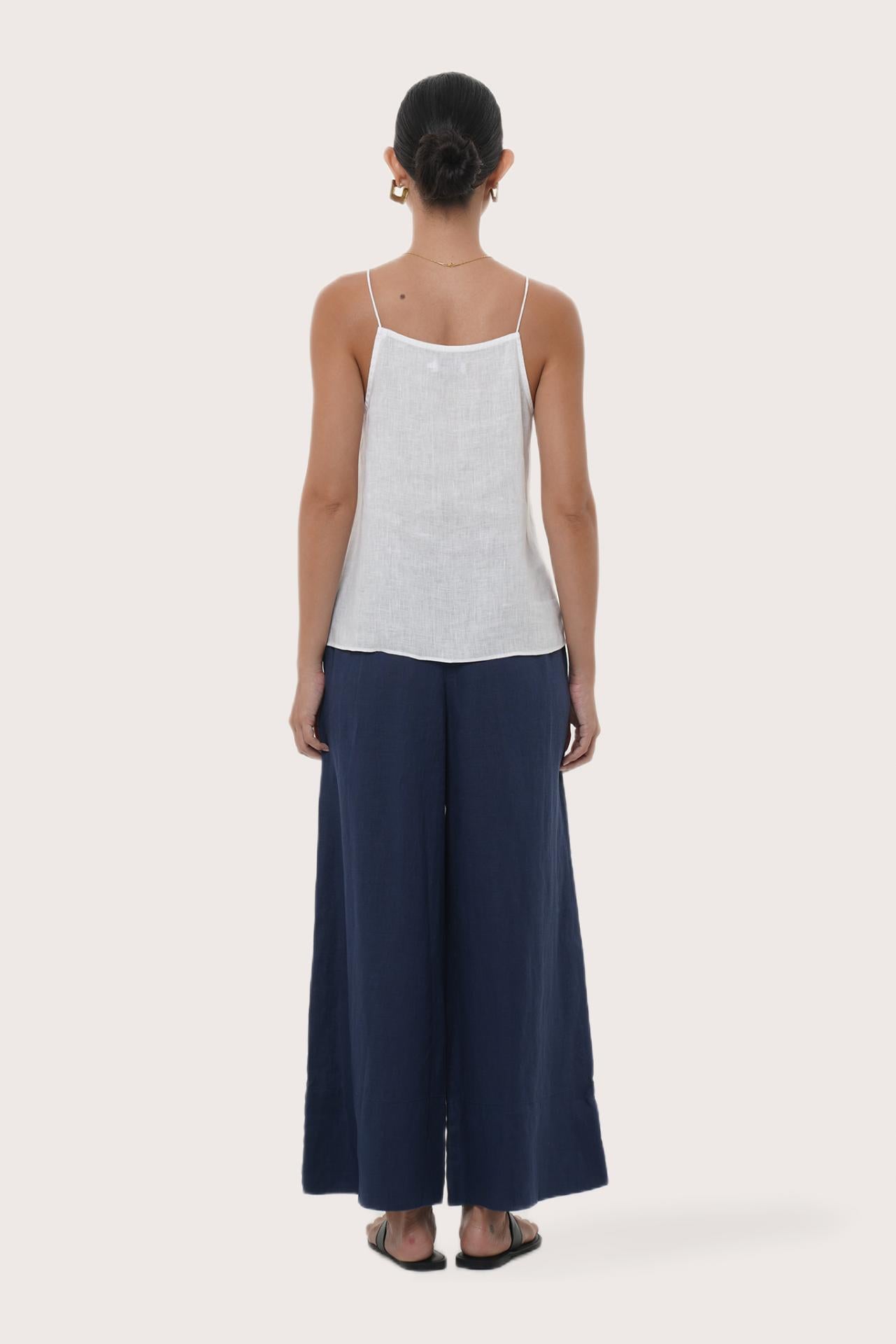 Back view highlighting the lightweight linen fabric, relaxed drape and minimalist design