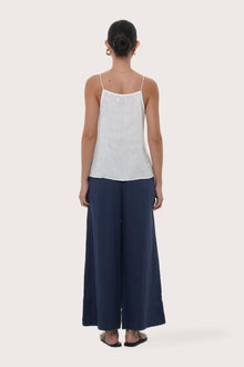 Back view highlighting the lightweight linen fabric, relaxed drape and minimalist design