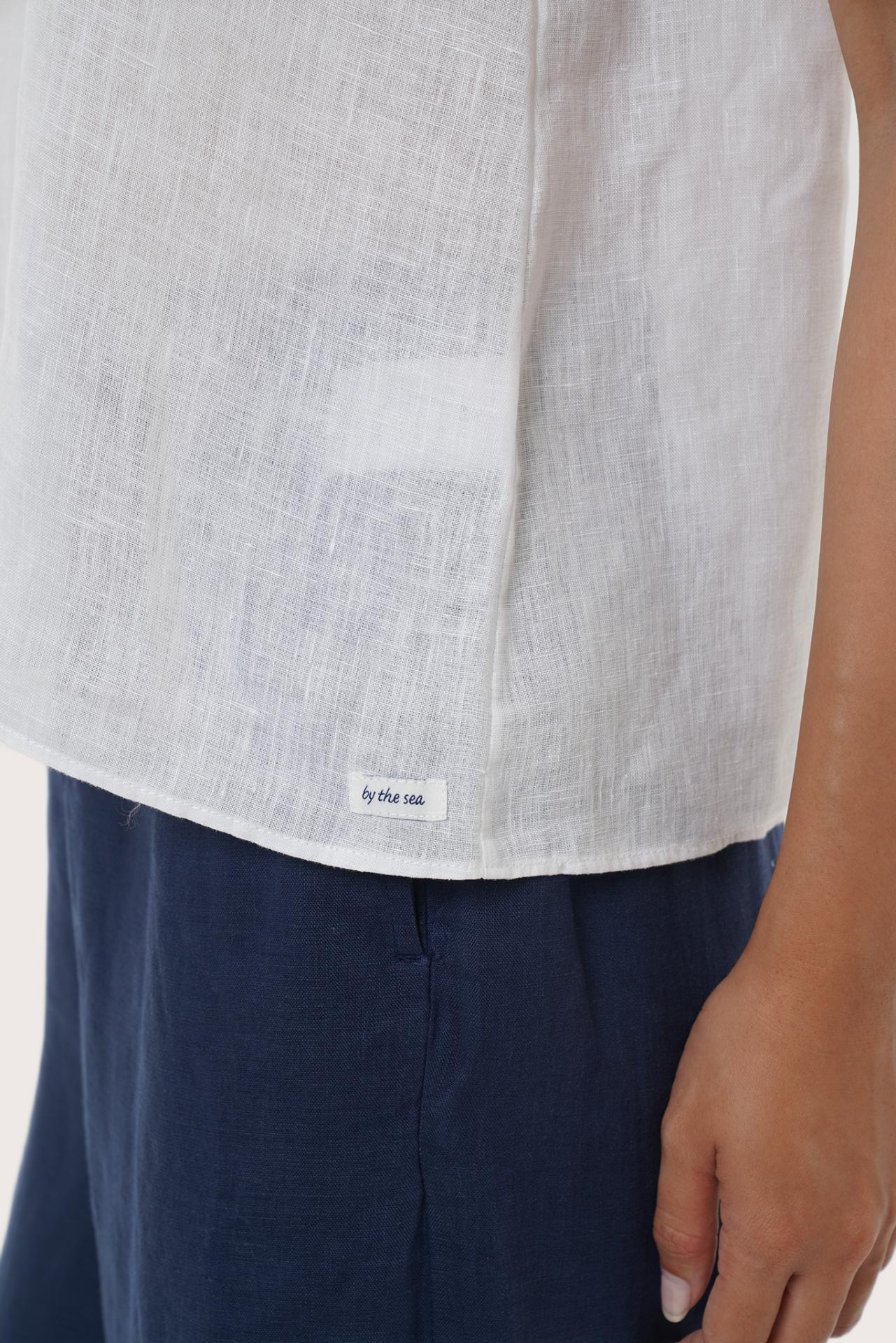 Close-up of the hem highlighting precise stitching and a clean finished edge