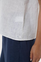 Close-up of the hem highlighting precise stitching and a clean finished edge