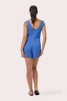 Back view of the Lisa Playsuit Blue highlighting the garment shape and drape