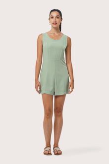 Woman wearing the Lisa Playsuit Sage designed for effortless resortwear and tropical living by By The Sea Bali.