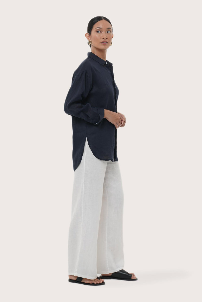 Side profile of the Loose Fit Linen Shirt Navy showing its cut and natural movement.