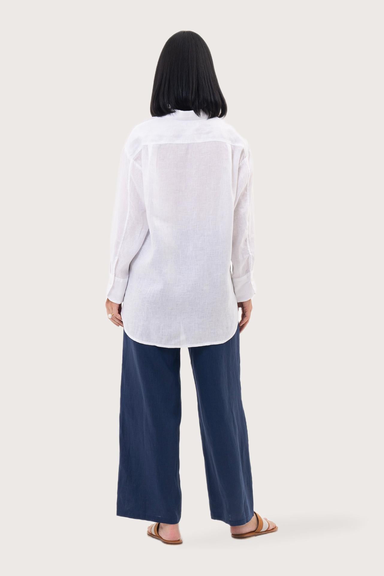 Back view of the Loose Fit Linen Shirt white highlighting the garment shape and drape.