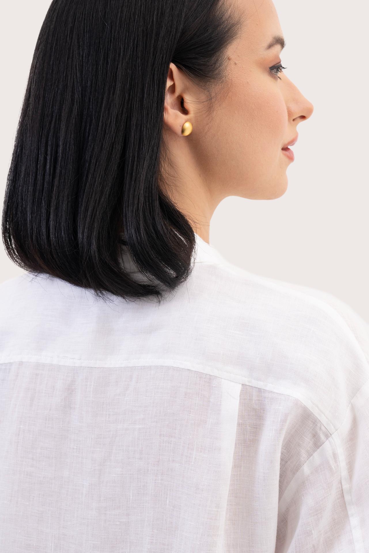 Back view detail of the Loose Fit Linen Shirt White highlighting the garment shape and drape.