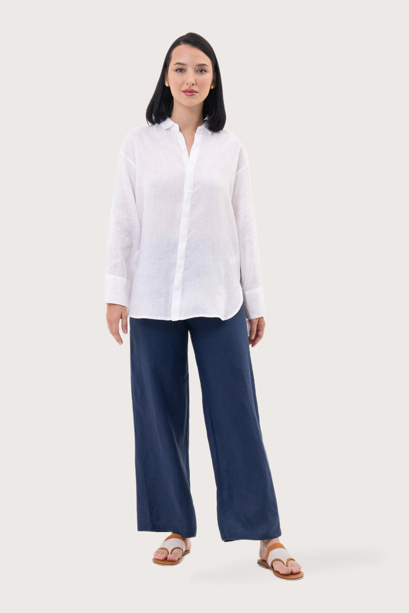Woman wearing the Loose Fit Linen Shirt White designed for effortless resortwear and tropical living by By The Sea Bali.