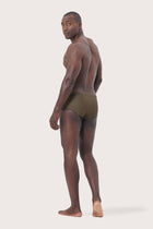 Model wearing Luka Swim Brief styled for luxury beach and resort wear
