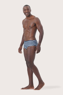 Side profile of Luka Swim Brief Stripes Layns highlighting its sleek and athletic design