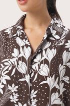 Close up detail of the Lupita Midi Dress Brown highlighting craftsmanship and design features