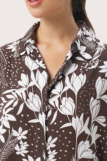 Close up detail of the Lupita Midi Dress Brown highlighting craftsmanship and design features