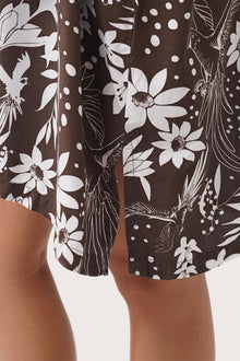 Close up detail of the Lupita Midi Dress Brown highlighting craftsmanship and slit design features