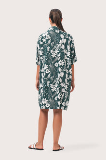 Back view of the Lupita Midi Dress Green highlighting the garment shape and drape