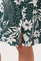 Close up detail of the Lupita Midi Dress Green highlighting craftsmanship and slit design features