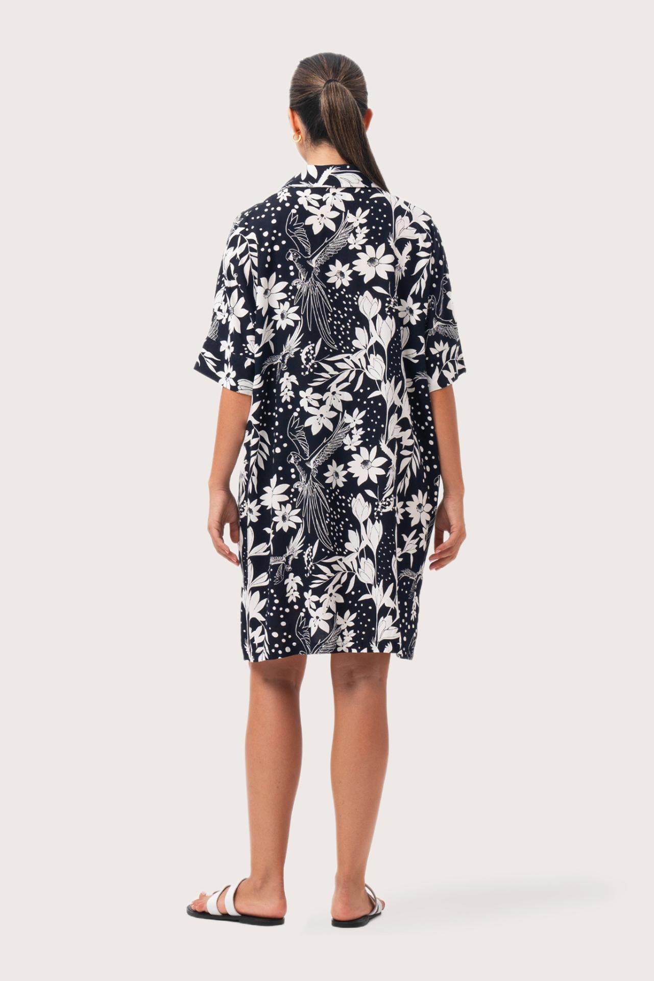 Back view of the Lupita Midi Dress Navy highlighting the garment shape and drape