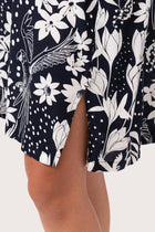 Close up detail of the Lupita Midi Dress Navy highlighting craftsmanship and slit design features