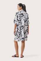 Back view of the Lupita Midi Dress White highlighting the garment shape and drape