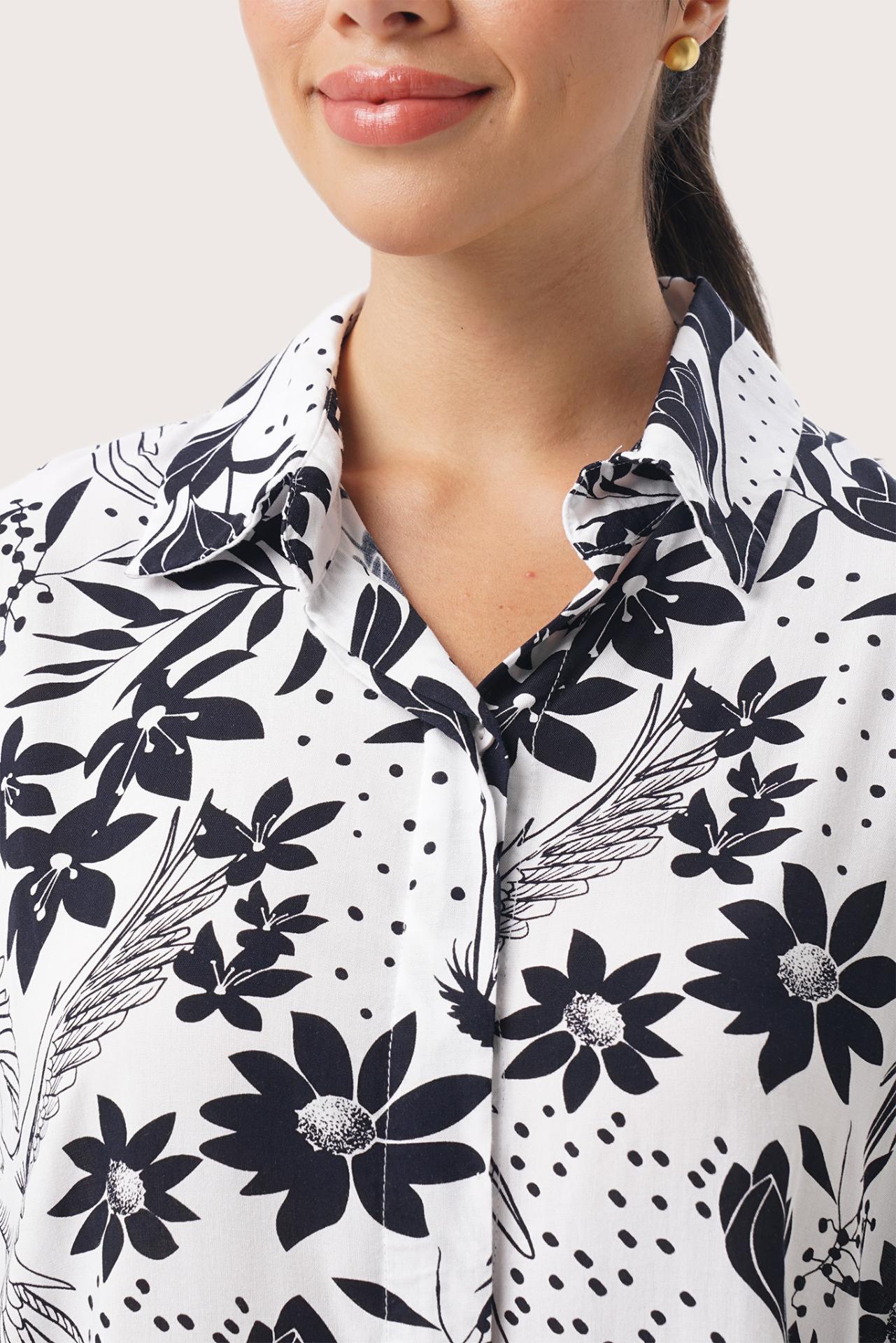 Close up detail of the Lupita Midi Dress White highlighting craftsmanship and design features