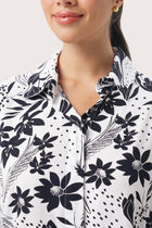 Close up detail of the Lupita Midi Dress White highlighting craftsmanship and design features