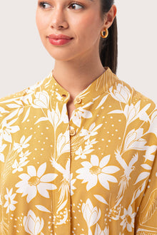 Close up detail of the Lupita Midi Dress Yellow highlighting craftsmanship and design features
