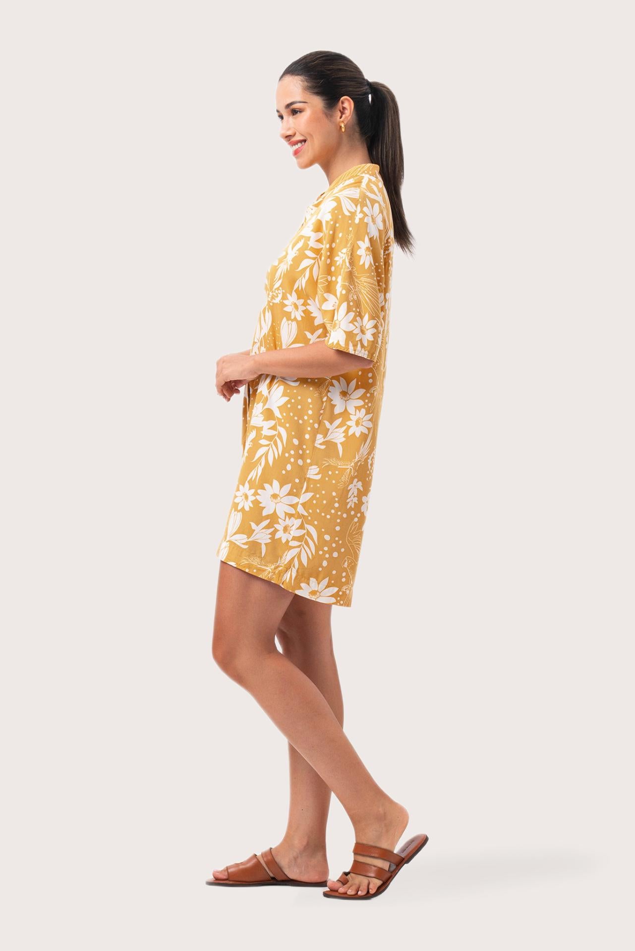 Side profile of the Lupita Midi Dress Yellow showing its cut and natural movement