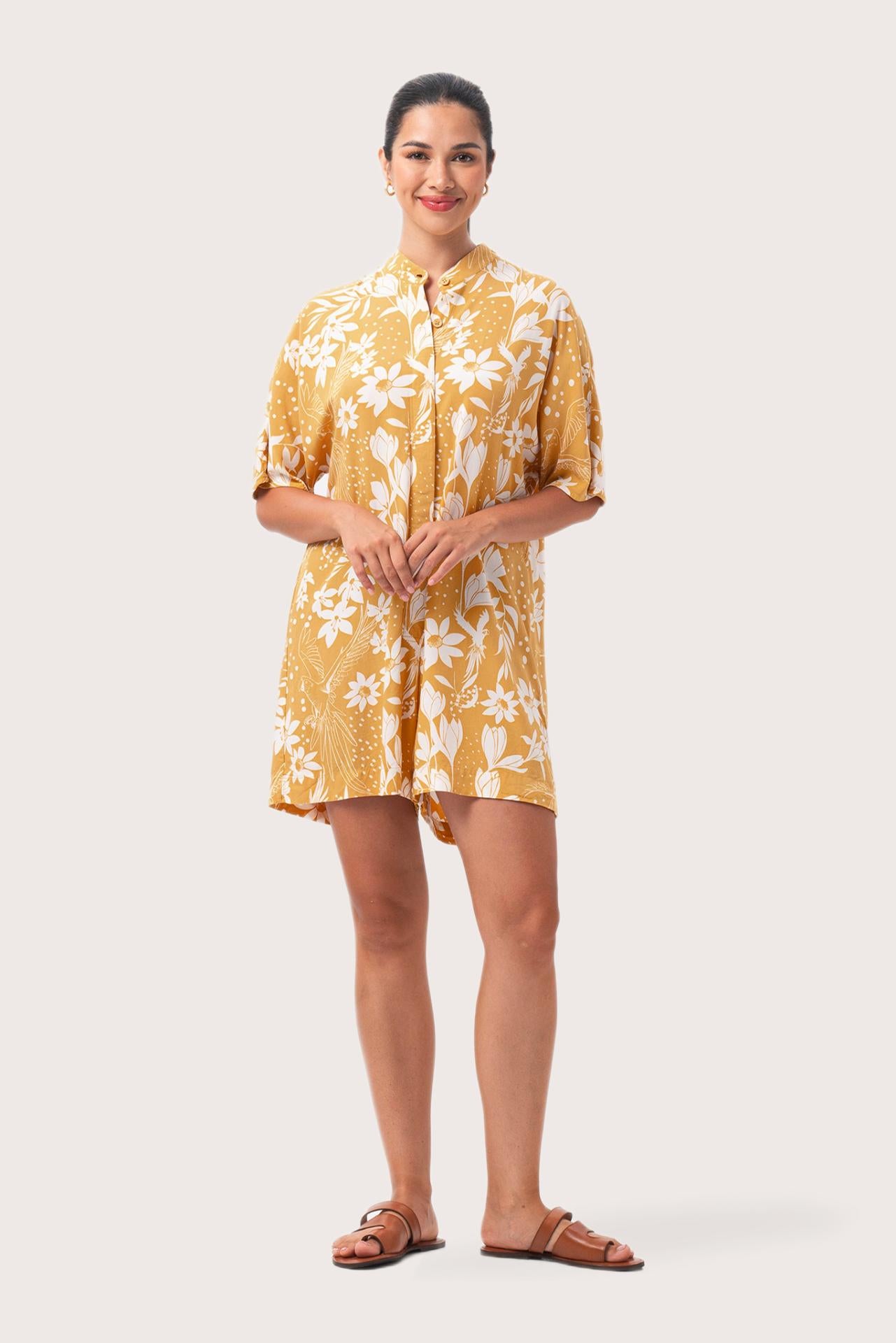 Woman wearing the Lupita Midi Dress Yellow designed for effortless resortwear and tropical living by By The Sea Bali