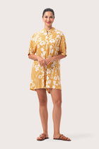 Woman wearing the Lupita Midi Dress Yellow designed for effortless resortwear and tropical living by By The Sea Bali
