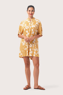 Woman wearing the Lupita Midi Dress Yellow designed for effortless resortwear and tropical living by By The Sea Bali