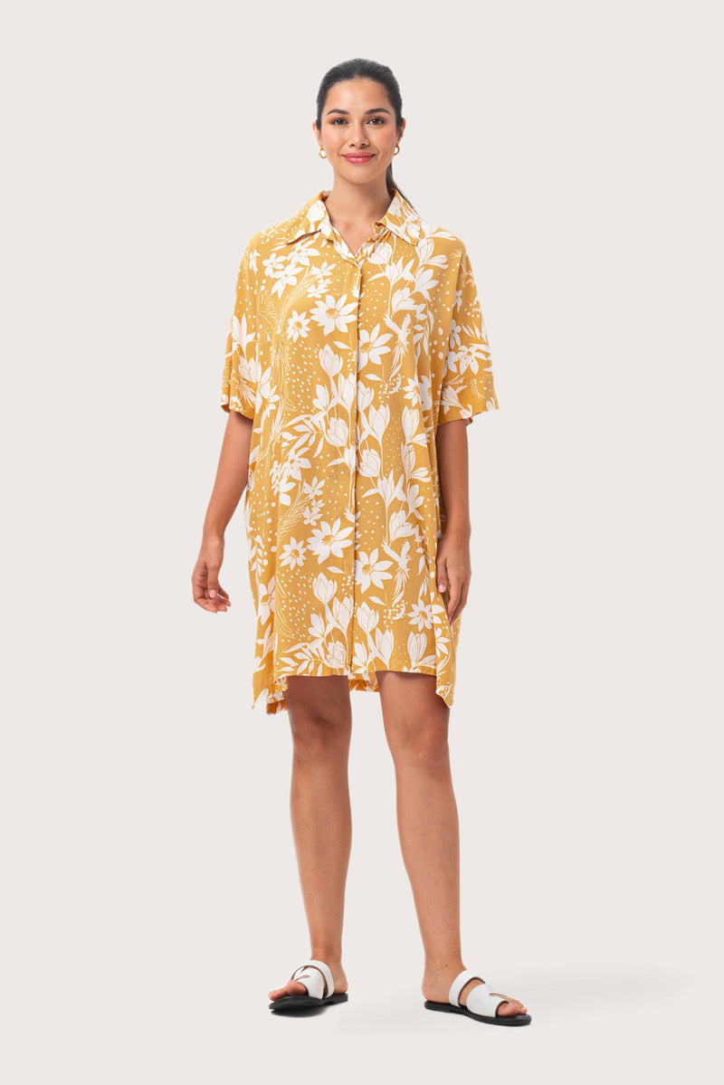 Model wearing the yellow Lupita midi dress by By The Sea Bali