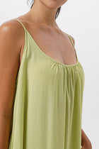 Close up detail of the Mala Lowback Maxi Dress Lime Green highlighting craftsmanship and design features