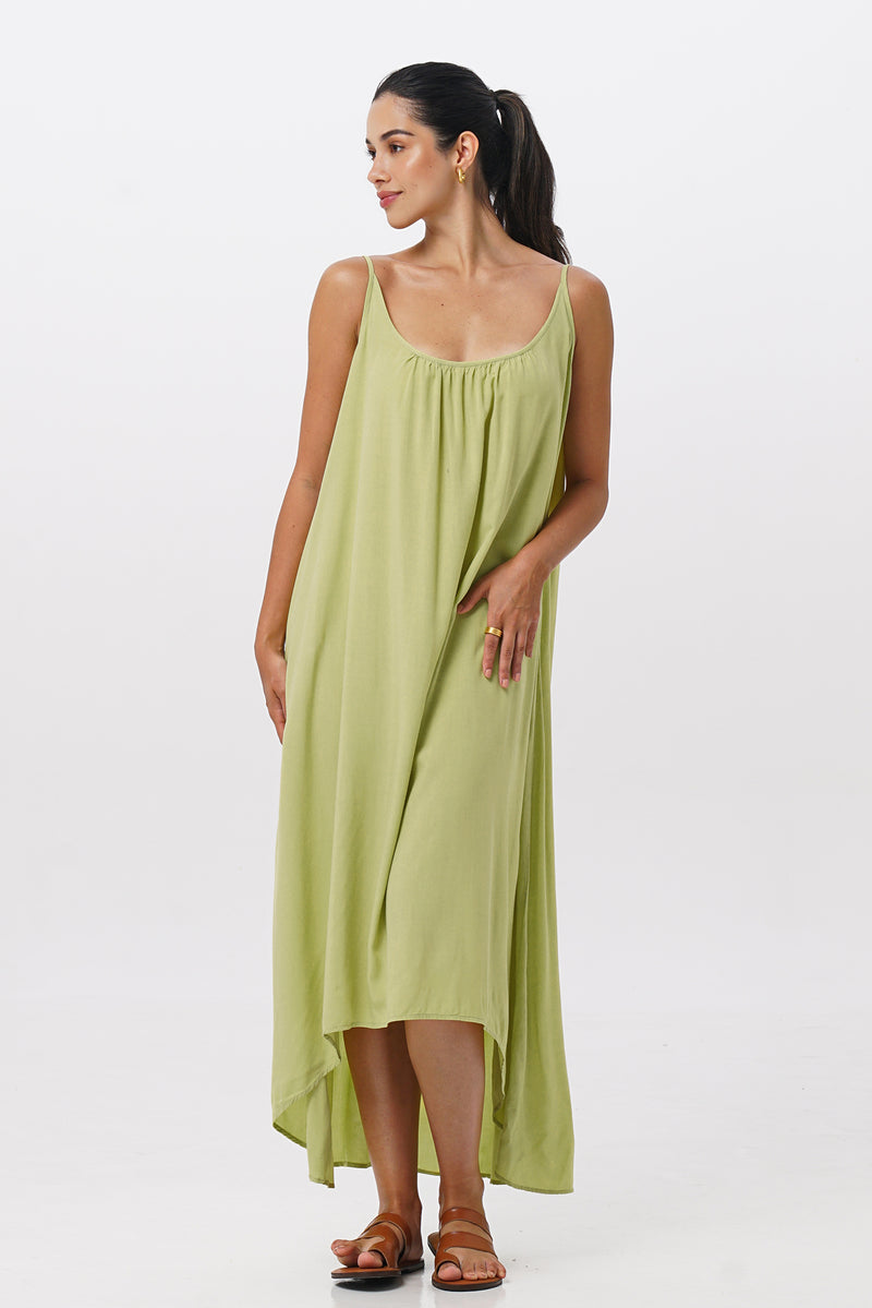 Woman wearing the Mala Lowback Maxi Dress Lime Green designed for effortless resortwear and tropical living by By The Sea Bali