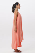 Side profile of the Mala Lowback Maxi Dress Rosa showing its cut and natural movement