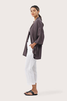 Side profile of the Maluku Outerwear Ash showing its cut and natural movement