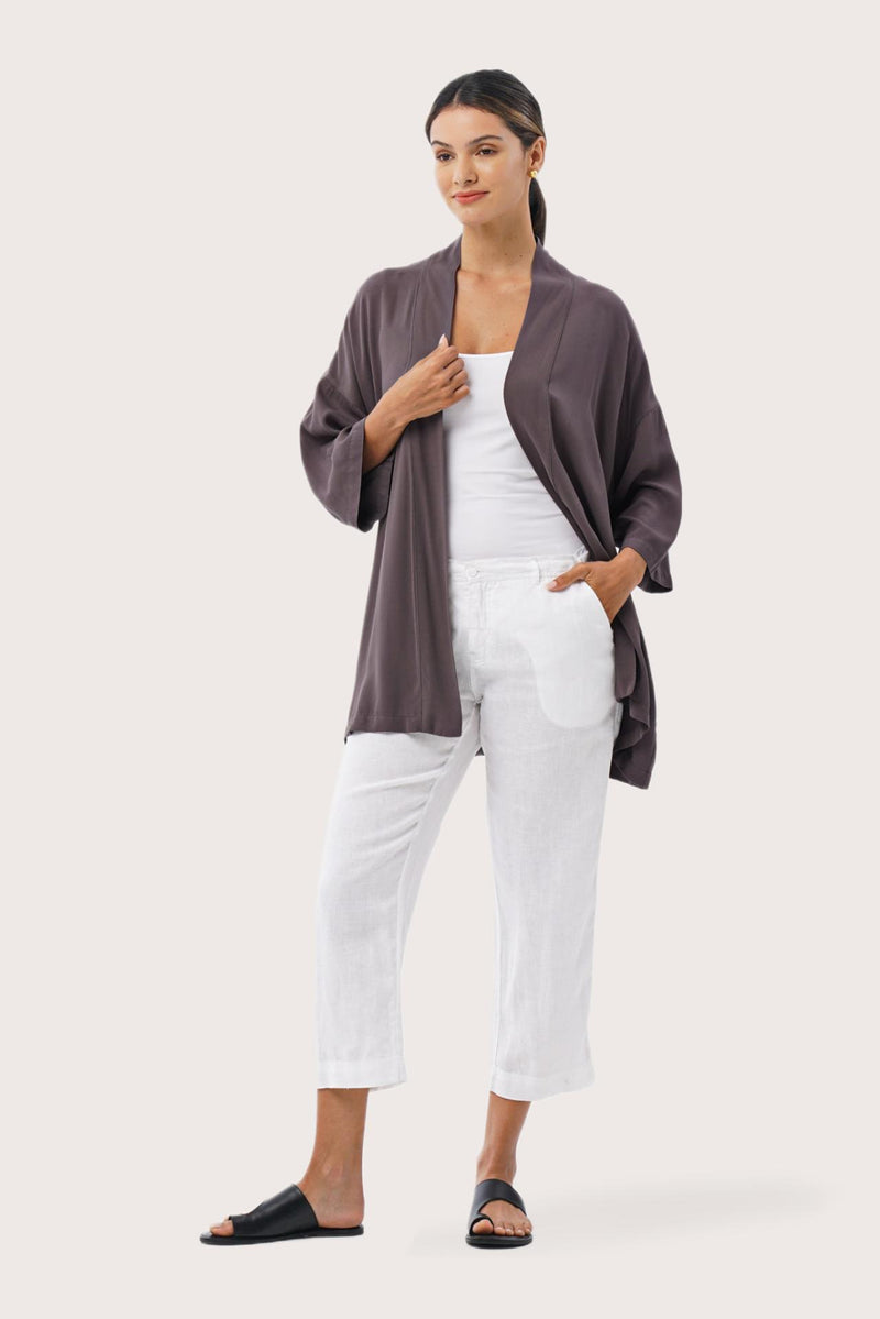 Woman wearing the Maluku Outerwear Ash designed for effortless resortwear and tropical living by By The Sea Bali.