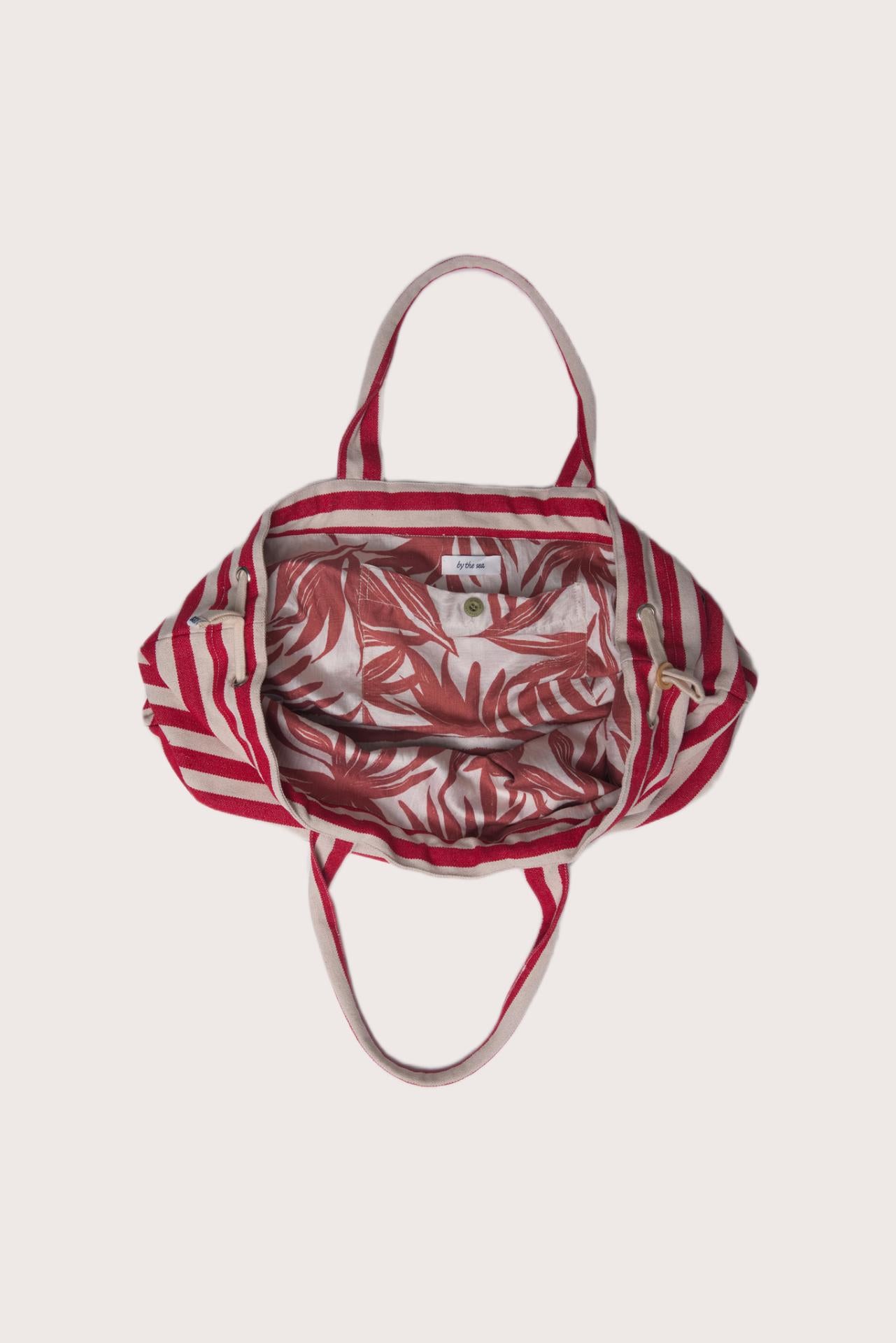 Full view of the Marmara Stripe Tote Bag Stripes capturing its spacious design and effortless vacation appeal
