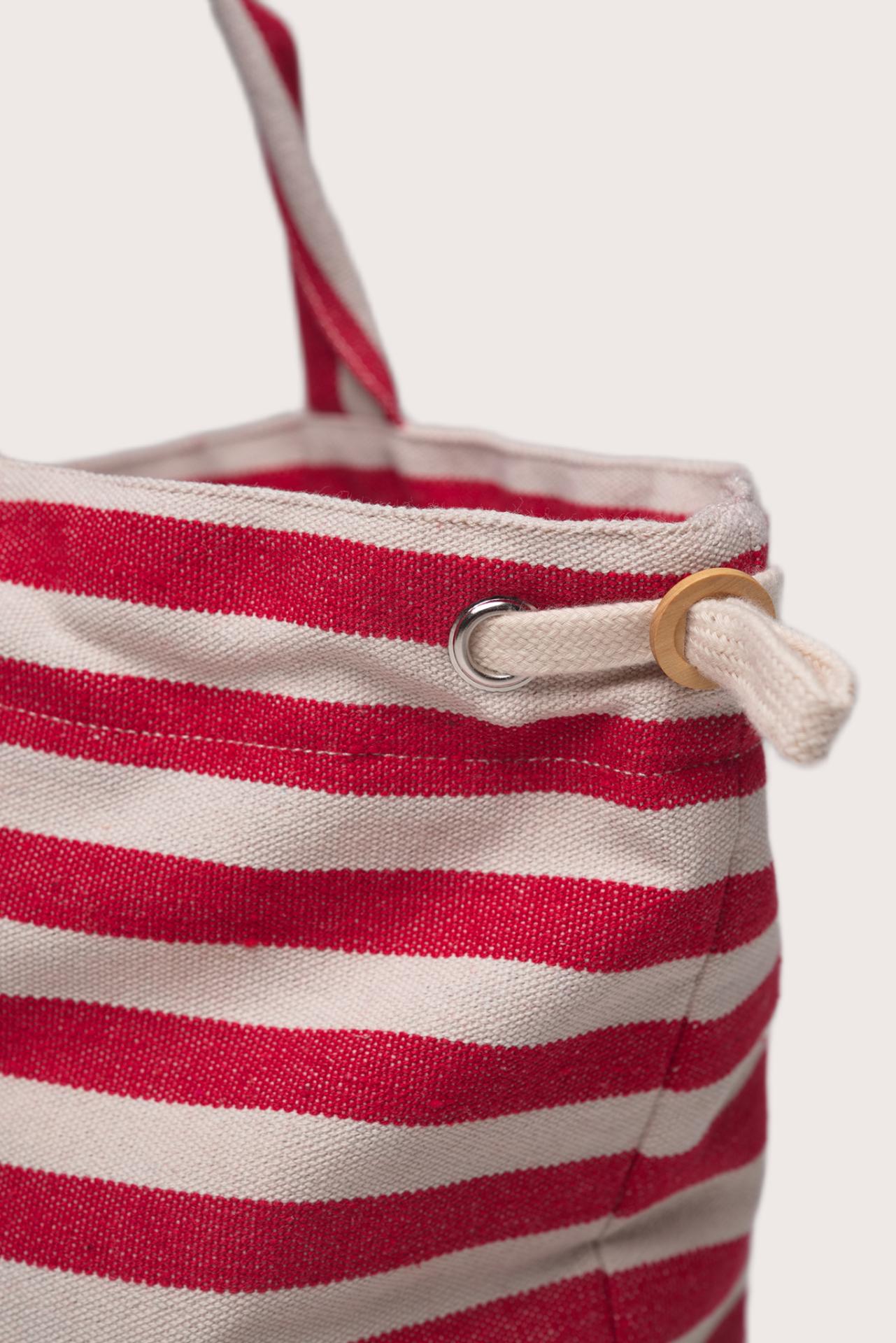 Side profile of the Marmara Stripe Tote Bag Stripes highlighting its spacious structure and elegant striped detailing