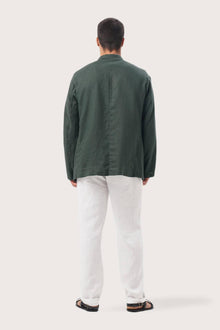 Back view of the dark green linen jacket with a relaxed and contemporary silhouette
