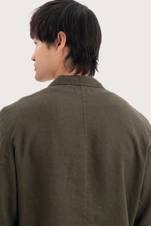 Detailed back view highlighting the linen construction and relaxed silhouette