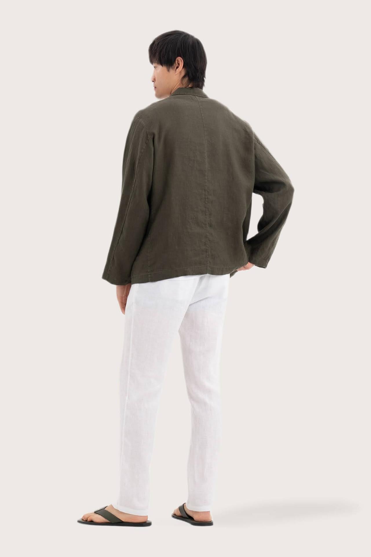 Back view of the dark green linen jacket with a relaxed and contemporary silhouette