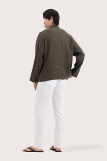 Back view of the dark green linen jacket with a relaxed and contemporary silhouette