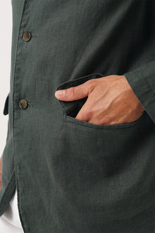 Close-up texture of the breathable linen fabric and premium craftsmanship