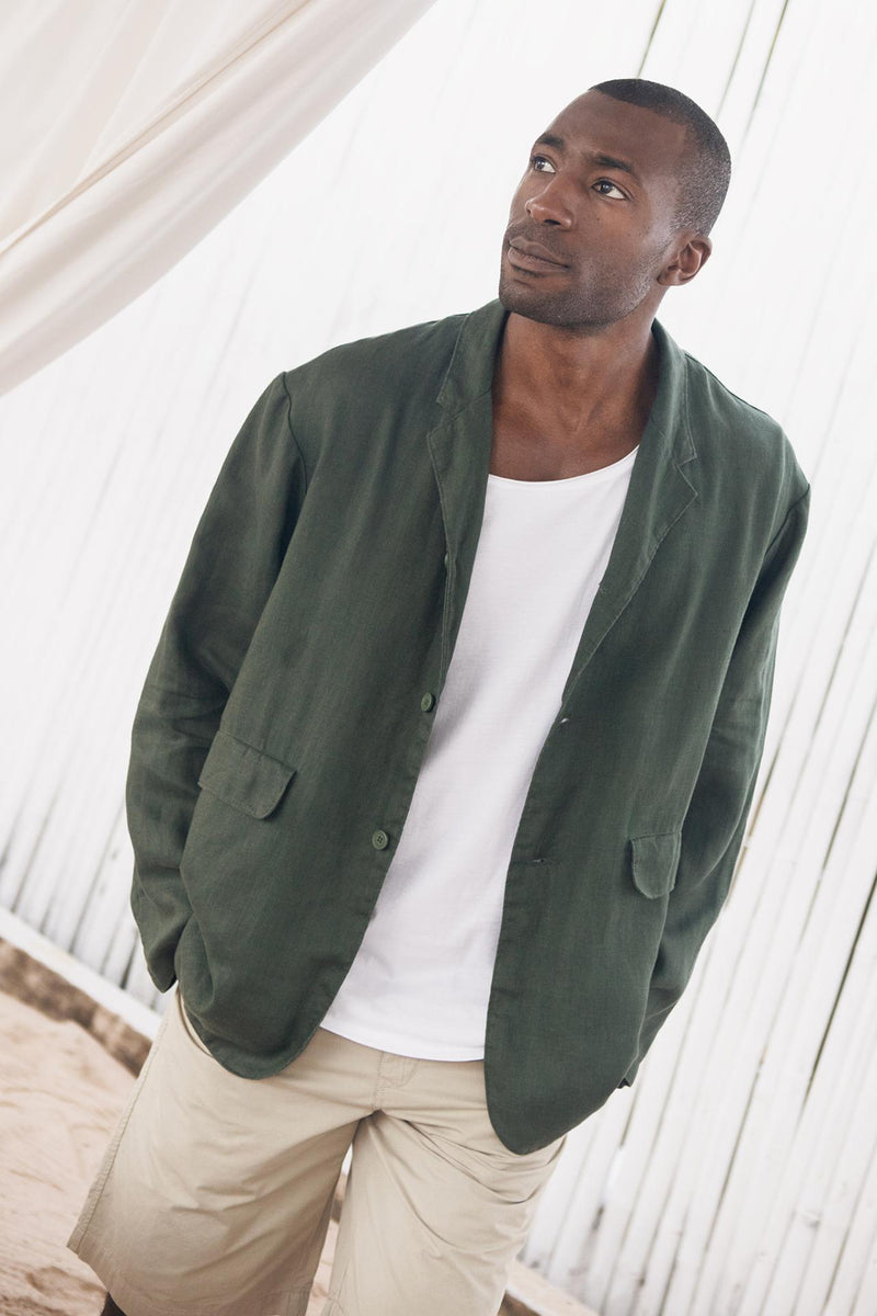 Model wearing the dark green linen Masa jacket by By The Sea Bali