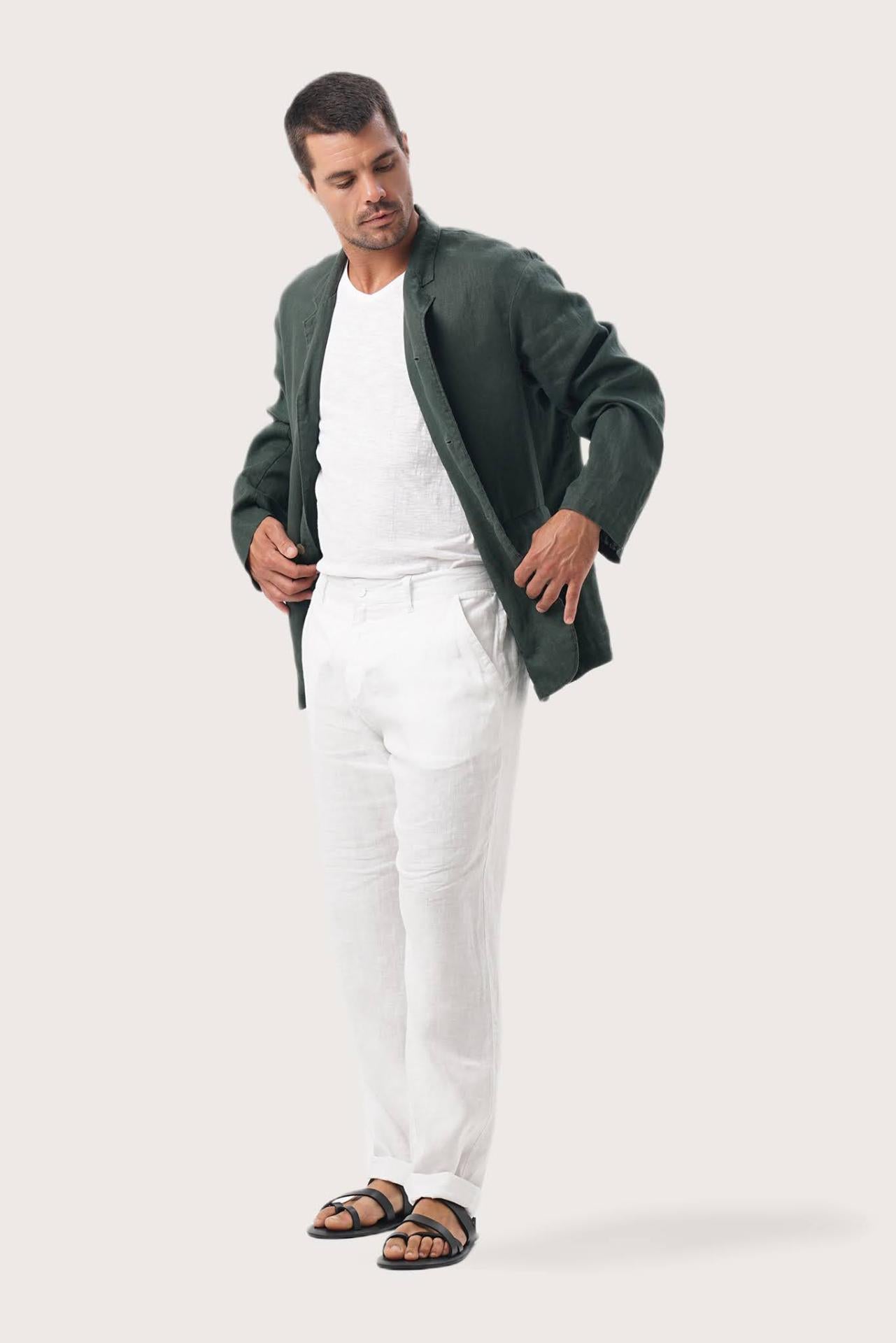 Side profile of the dark green linen jacket showcasing its comfortable fit and effortless drape