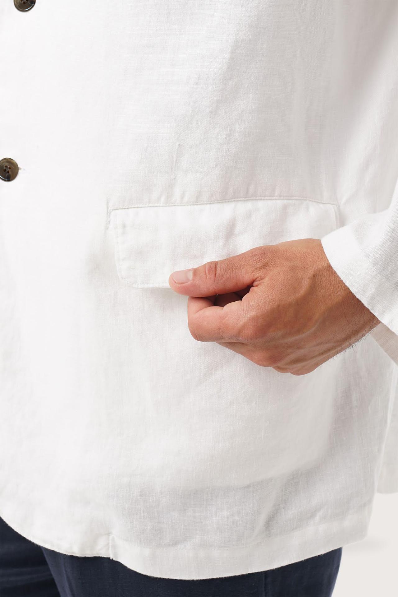Close-up texture of the breathable linen fabric and premium craftsmanship