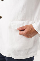 Close-up texture of the breathable linen fabric and premium craftsmanship
