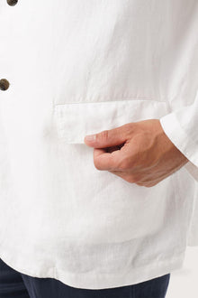 Close-up texture of the breathable linen fabric and premium craftsmanship